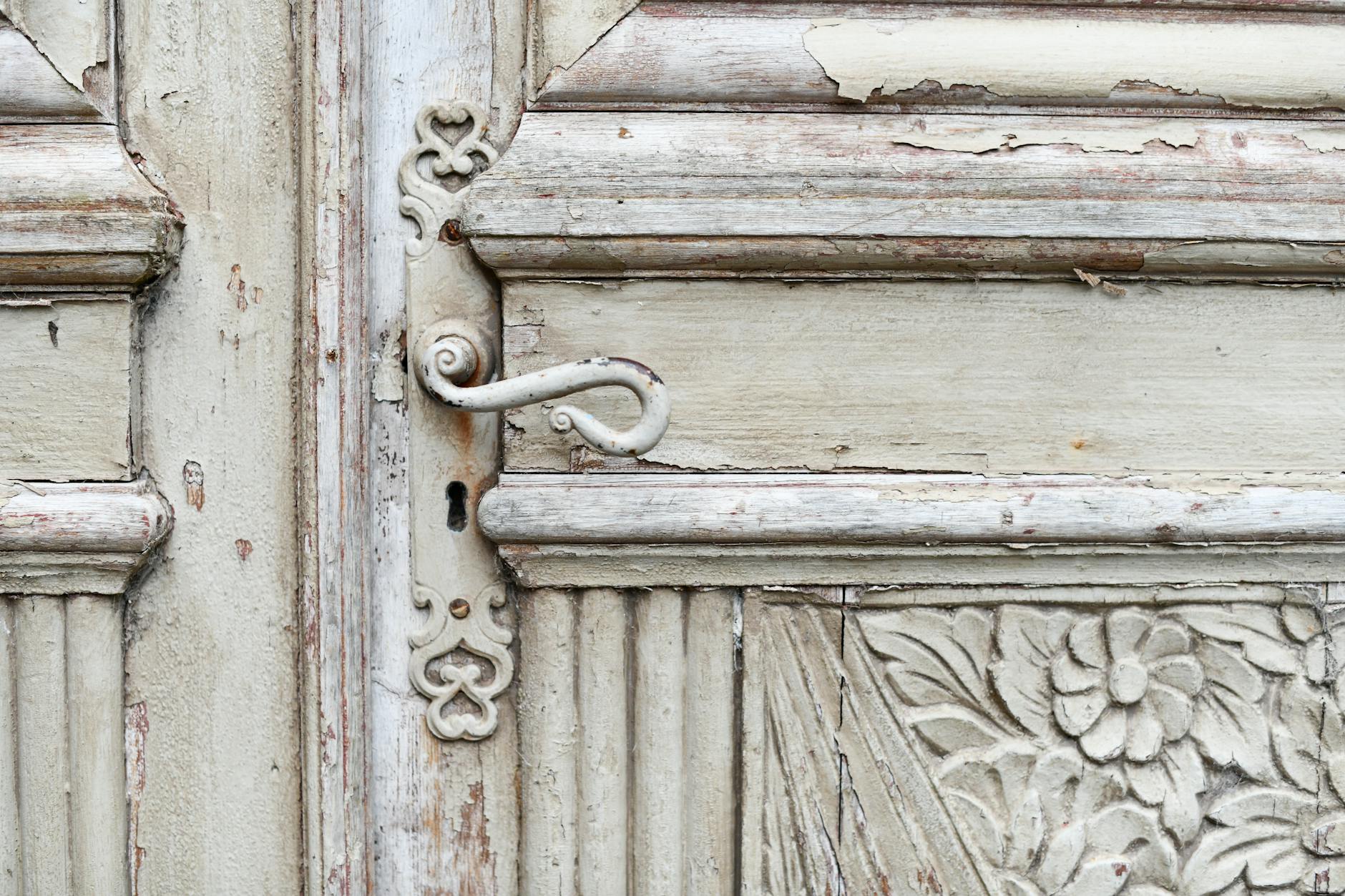 Detail shot of a wooden chair back featuring a carved Lyre harp motif in the center - Antique identification guide