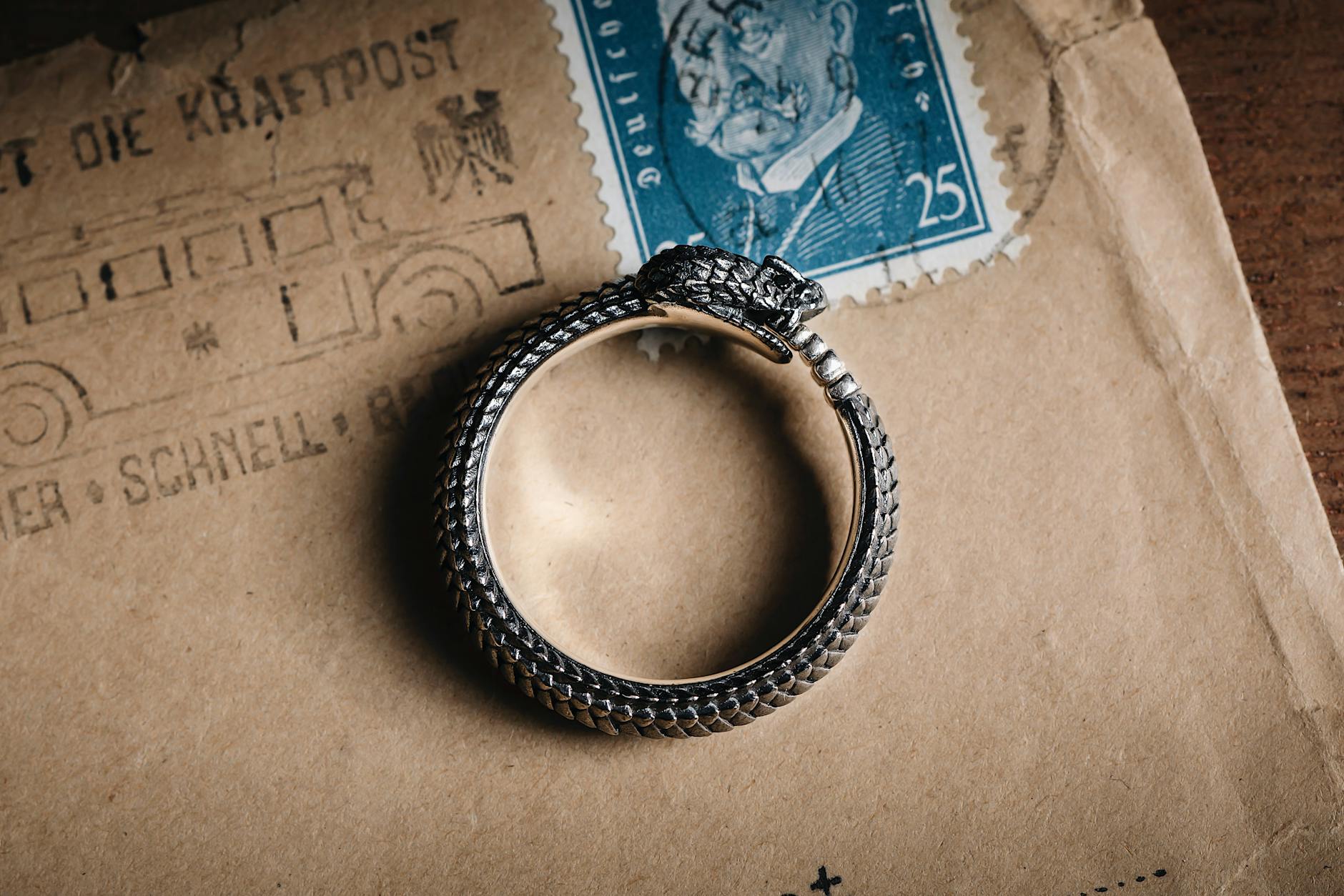 A split image showing a spoon back stamped 