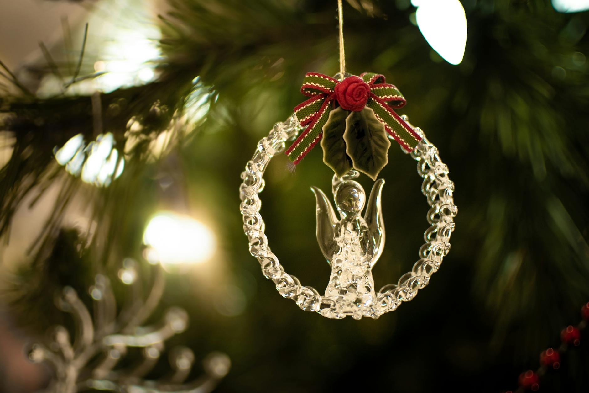 A visual comparison of a bright, new mirror-like reproduction ornament next to a duller, slightly spotted antique original - Antique identification guide