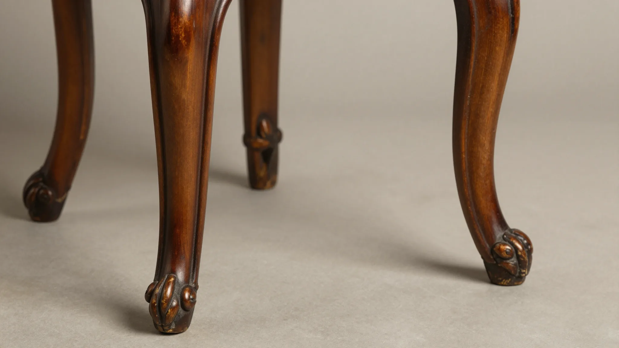 Antique chair leg styles featuring cabriole, Queen Anne, and ball-and-claw.
