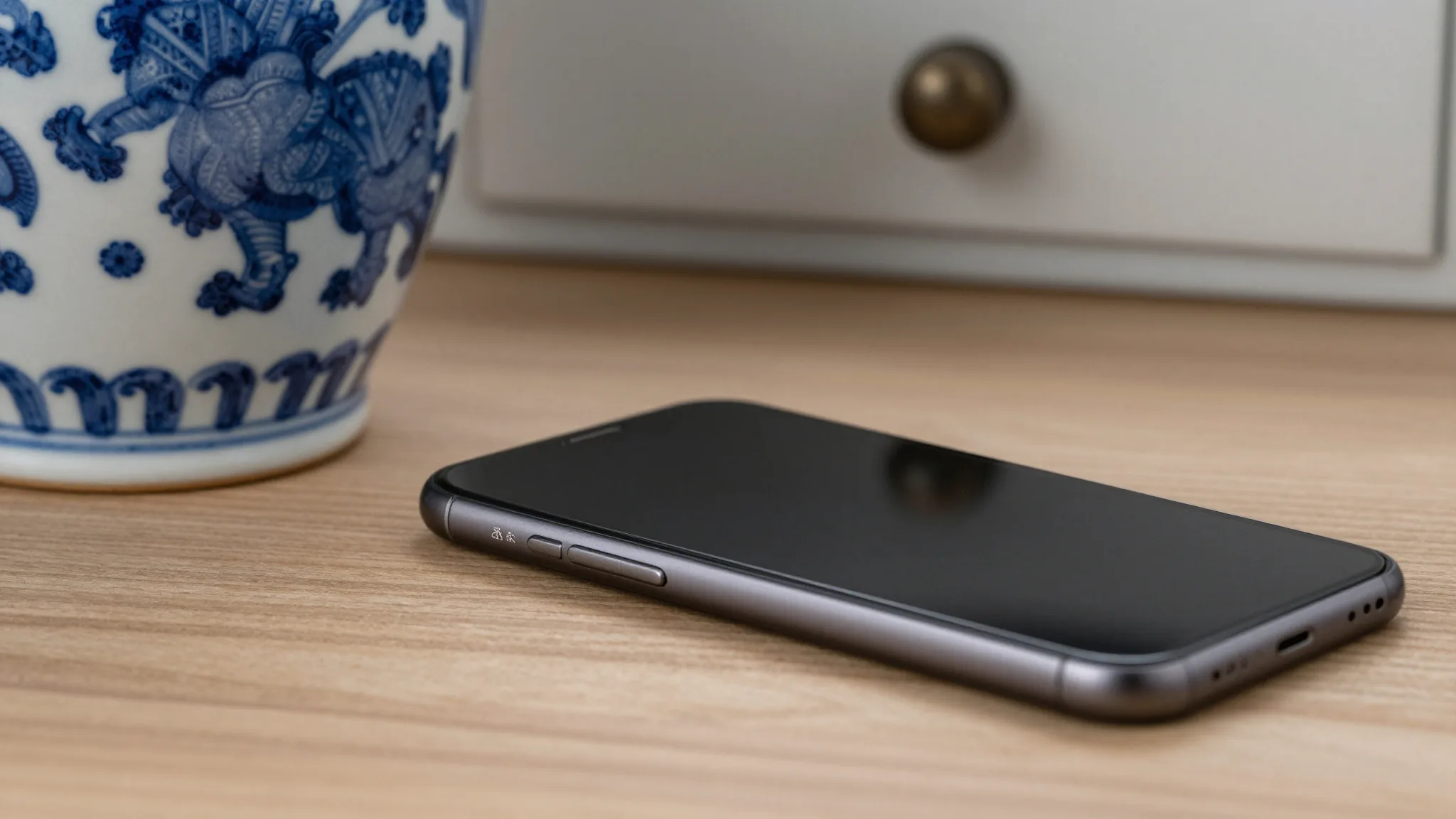 Free vs paid antique identification apps comparison on smartphone with antiques